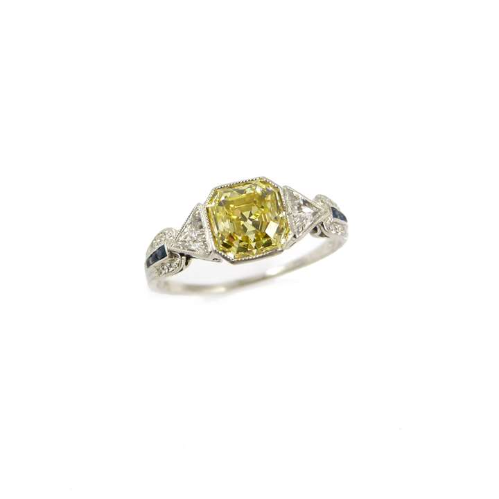 Fancy vivid yellow diamond and fancy cut diamond ring